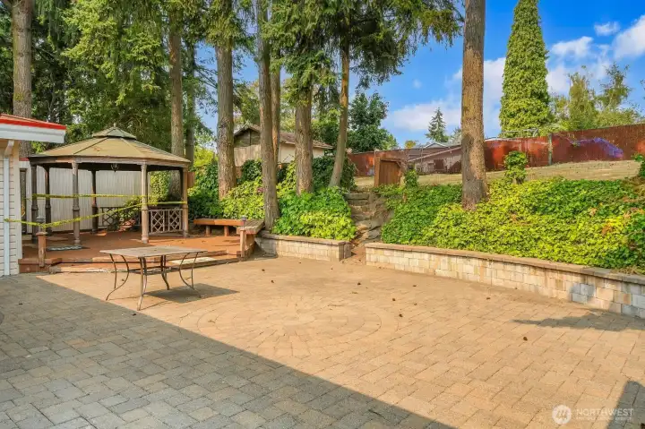 Massive patio outside of sliding glass doors from living room or upstairs formal dining room.