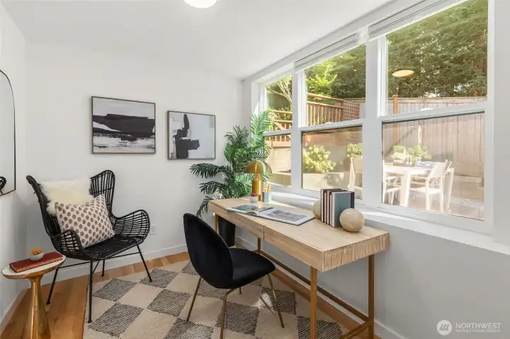 Main level bedroom/office overlooking large fenced yard