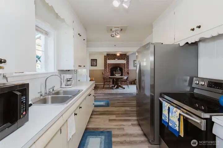 Kitchen looking toward a more formal dining room or could be used as a flex space.