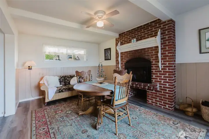 Dining or flex space! The fireplace is a cozy addition no matter the use!