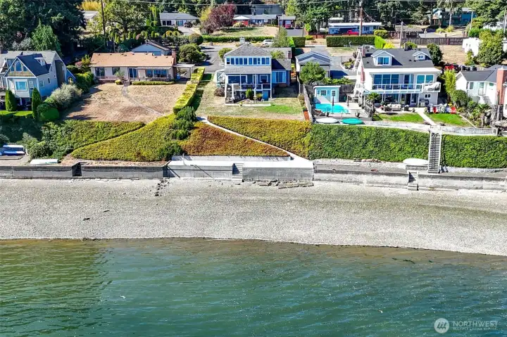 Drone shot of beach and home.