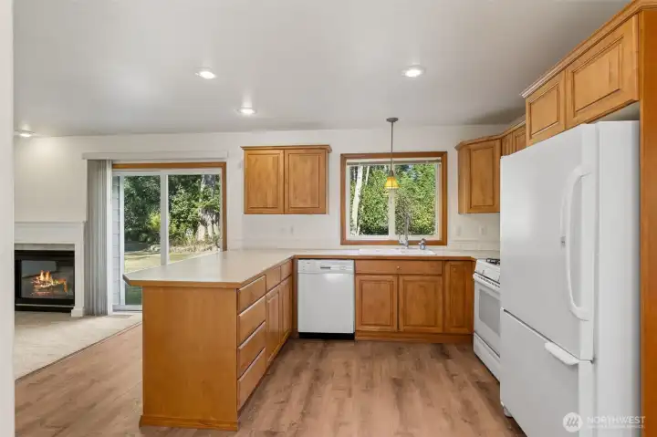 Plenty of cabinet space and the peninsula (will fit 4 bar stools) overlooking the living room.