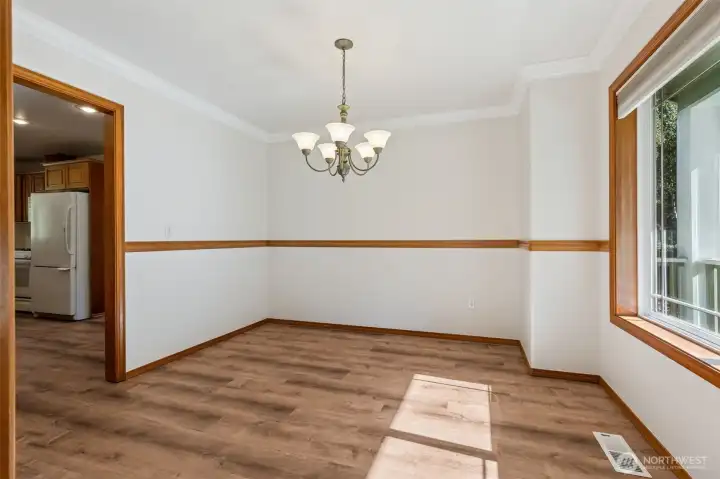 Formal dining room looks onto the front yard.