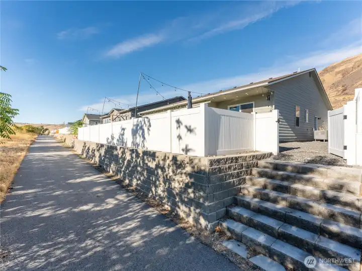 backyard open to golf cart trail.