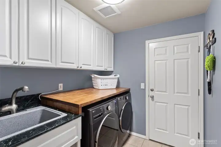Utility room with storage and counter space