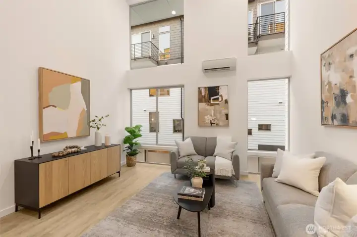 The elevated design draws your eyes up while seamlessly blending living, dining, and kitchen spaces.