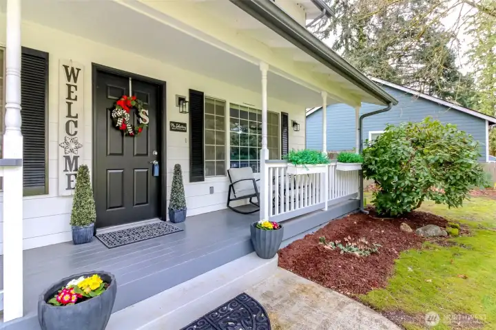 Welcoming front porch complete with flower boxes and plenty of room to sit and enjoy the view!