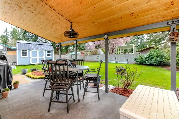Huge covered back porch- complete w/50" flat screen TV that conveys with the home.