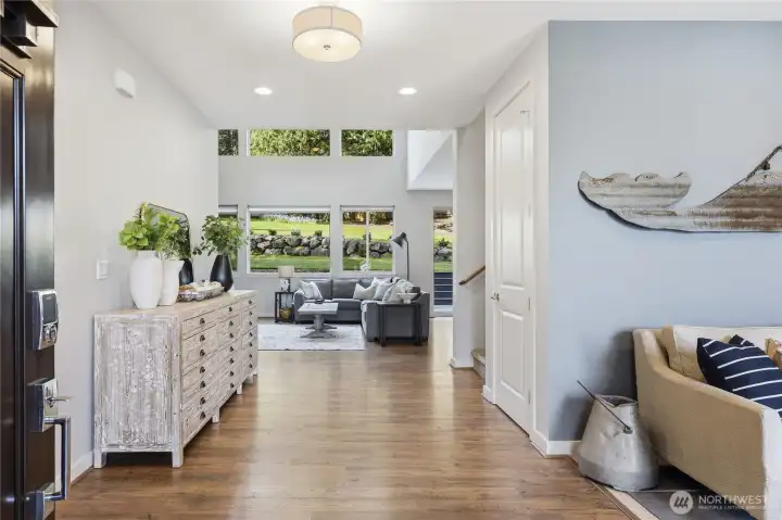 Entry into a gracious foyer - the den is on the right and the greatroom ahead