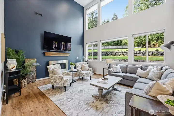 Soaring ceilings and wonderful windows, with view to private backyard.  Remote control for upper windows on bright days