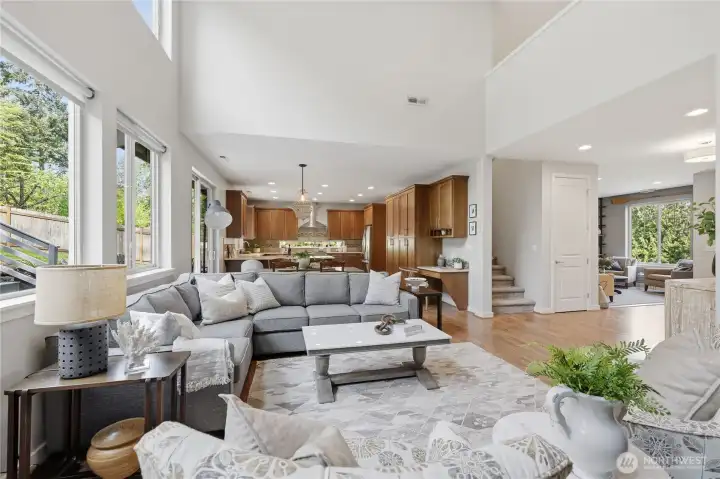 From the freatroom fireplace, a view of the kitchen/dining areas, stairwell to the upper loft and more.