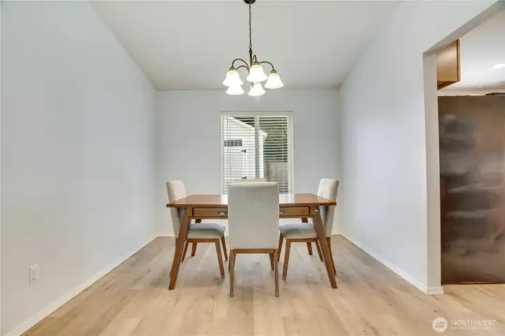 The dining room is perfectly placed between the living room and kitchen. Seating for a few, or turn your table and seat a whole crowd.