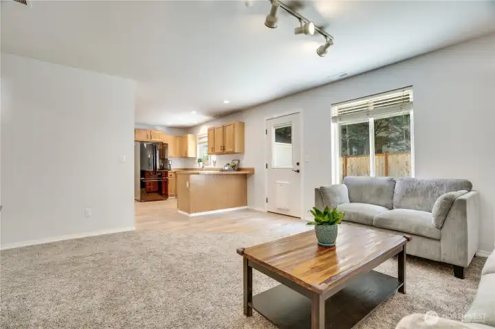 Upgraded recessed lighting and the laminate floors lead the way from the living and dining room to the kitchen and then flows seamlessly in to the family room.