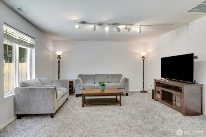 The newer plush carpet was just professionally cleaned and makes this room the best place for movie nights, great conversation with friends or just a restful night at home.