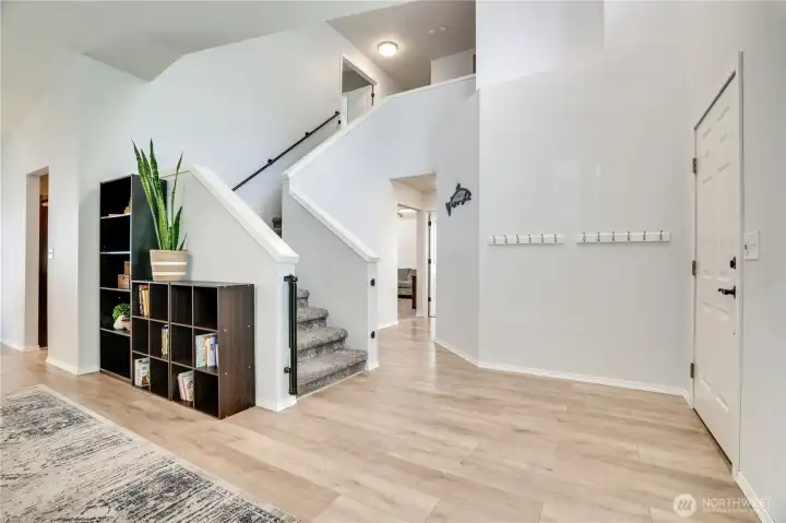 This thoughtfully designed home is filled with natural light and the laminate floors are a breeze to maintain in all of the main living areas! Let's head upstairs.