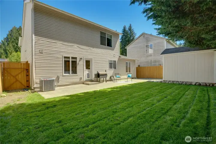 The backyard has just been re-sodded and features an extended patio and massive storage shed!