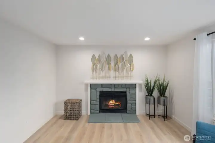 Cozy living space with fireplace feature wall and updated flooring in Snohomish near Blackmans Lake.