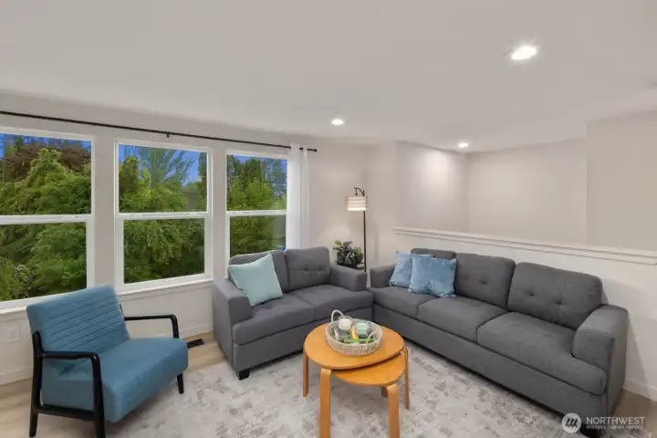 Open living and dining area with natural light, updated flooring, and functional layout in Snohomish