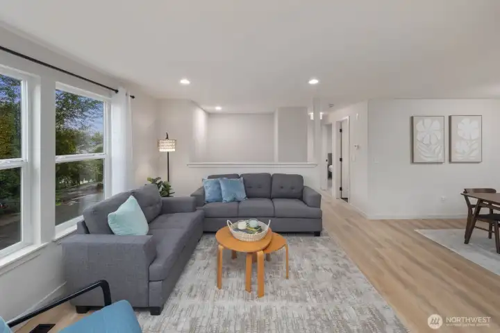 Open living and dining area with natural light, updated flooring, and functional layout in Snohomish