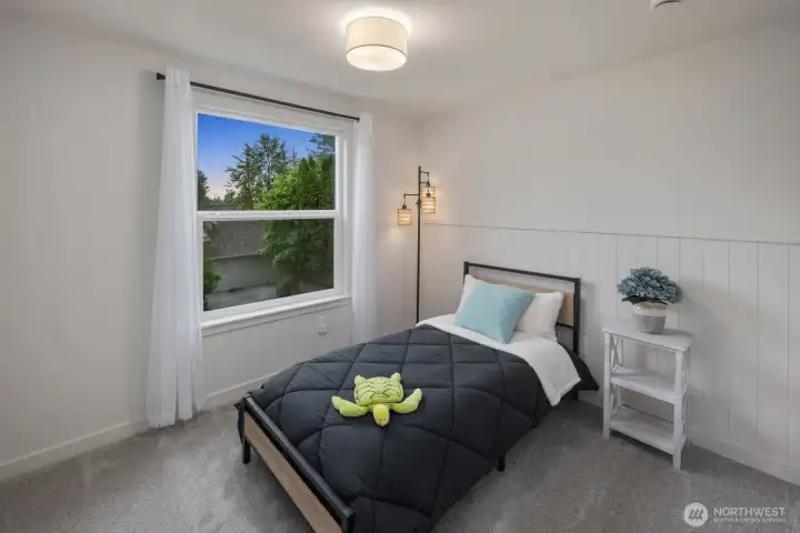 Bedroom with natural light and partial views of Blackmans Lake.