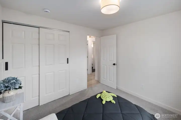 Spacious bedroom with closet and easy access to hallway and bath.