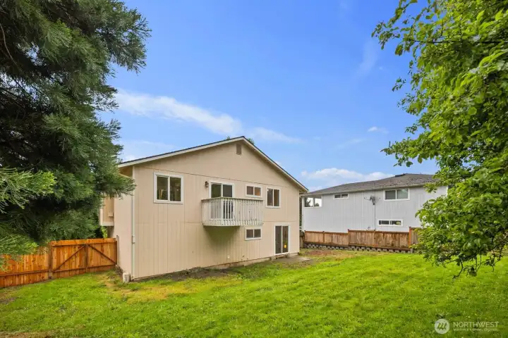 Spacious, fully fenced backyard—great for relaxing, entertaining, or pets.