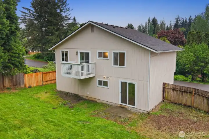 Fully fenced backyard with patio space and room to enjoy the outdoors.