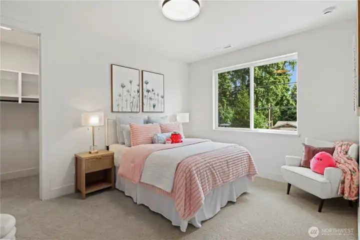 Bright south-facing upper bedroom with space for a queen bed and a desk, and dresser, or a sitting area.