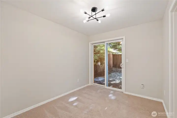 Lower level bedroom with walk-out to fenced backyard