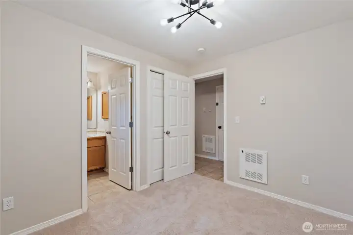 Lower level bedroom with walk-out to fenced backyard