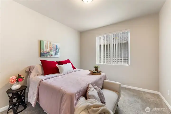 Spacious guest bedroom with 9ft ceilings.