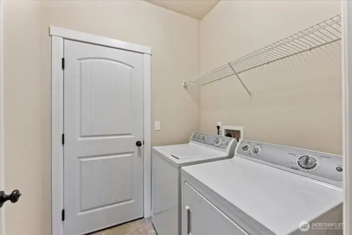 Utility room with washer and dryer.