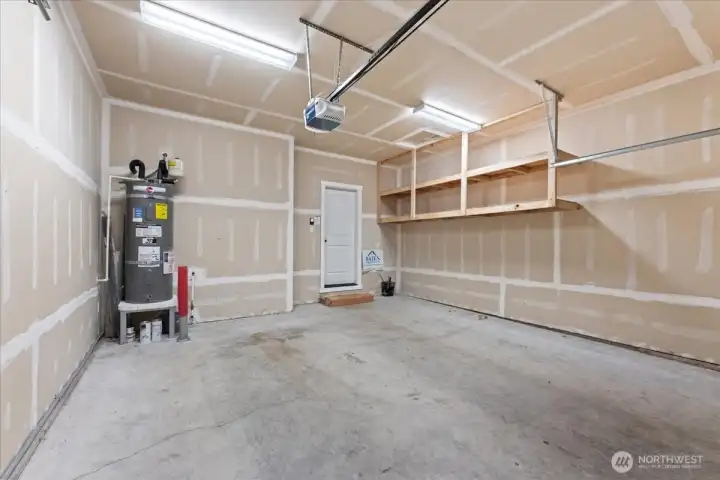 2 car garage with built in shelving.