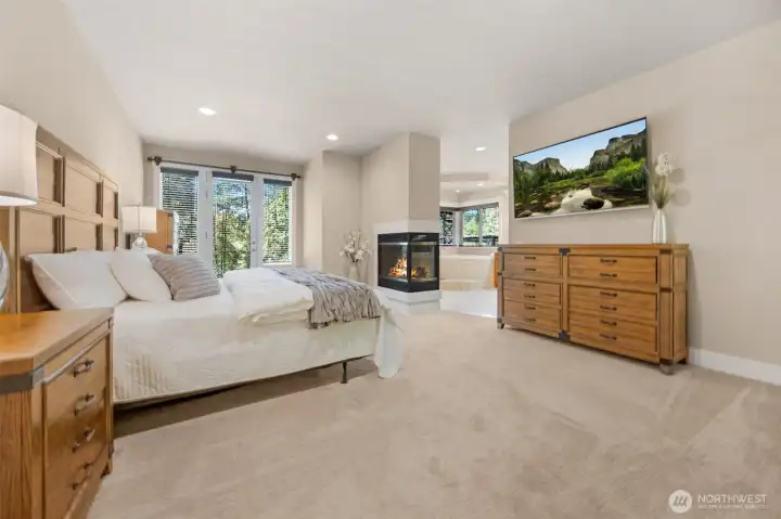 Spacious primary suite with patio access, gas fireplace, and luxury bathroom. Spacious primary suite with patio access, gas fireplace, and luxury bathroom.