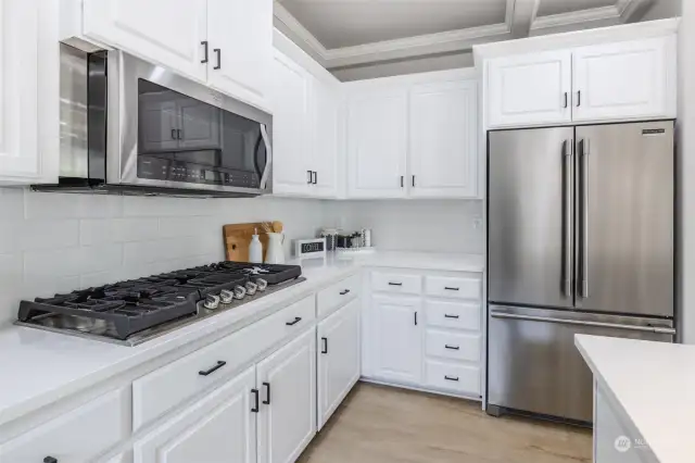 New gas stove top and refrigerator.