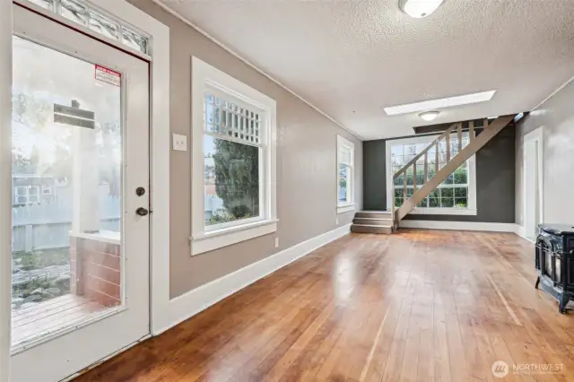 Living room with skylight and large windows