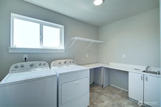 Convenient upstairs laundry room.