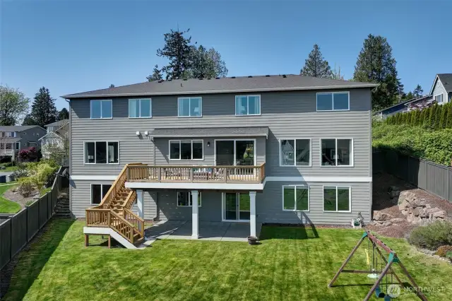 Back of house with large deck.  Beautiful view of the Cascade mountains from inside the home or from the deck.