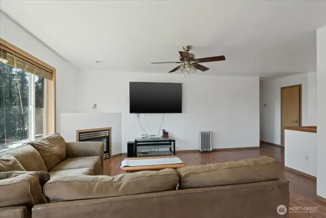 Living room, offers fireplace, open floor concept