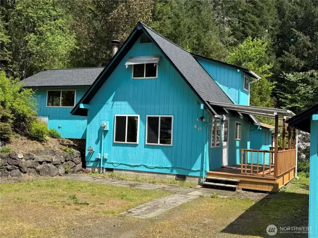 Front of home with driveway park and great sitting porch!