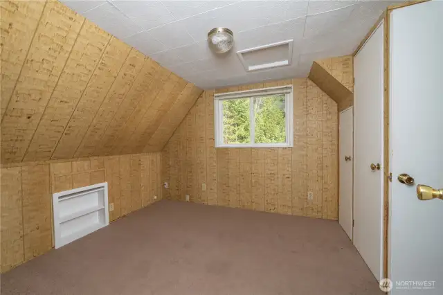 Upstairs bedroom with half bath