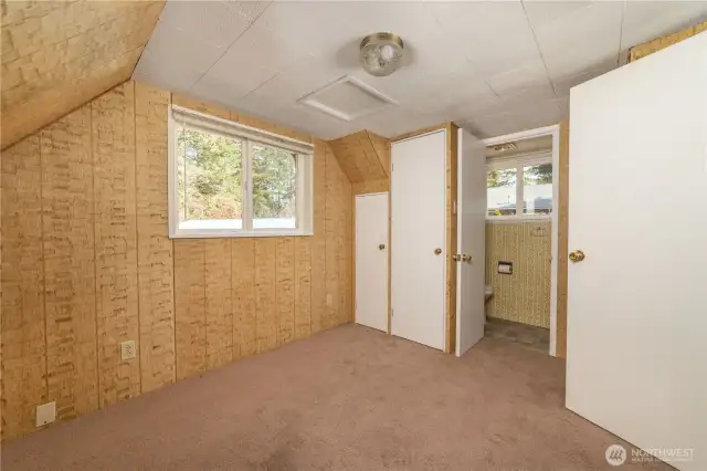 Upstairs bedroom with half bath