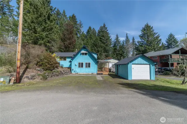 Front of home with driveway parking and garage