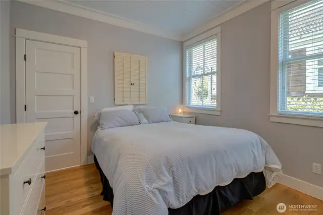 The back bedroom with access to the back bathroom.