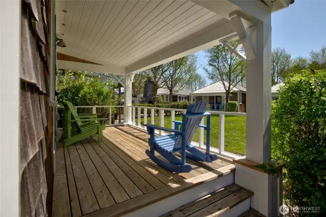 The south facing covered porch offers a quiet space to listen to the birds and ocean.