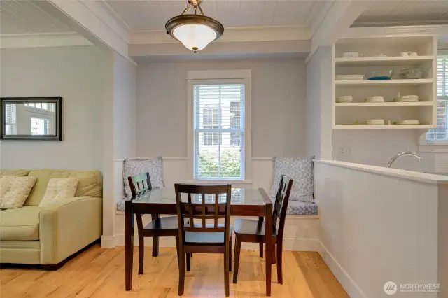 The built in dining bench offers storage below.