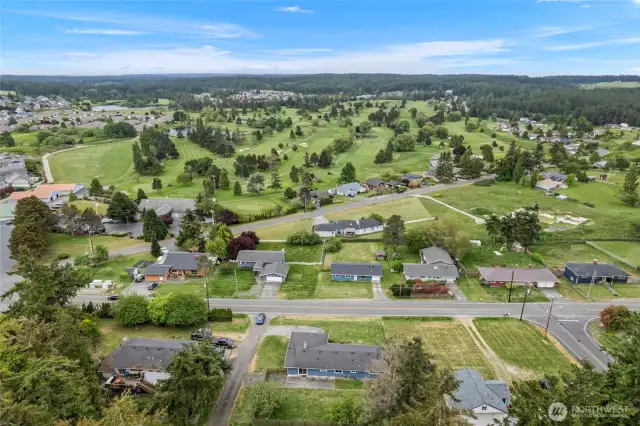 Overlooking the golf course and towards the Olympic Mountains which are viewable on clear days.