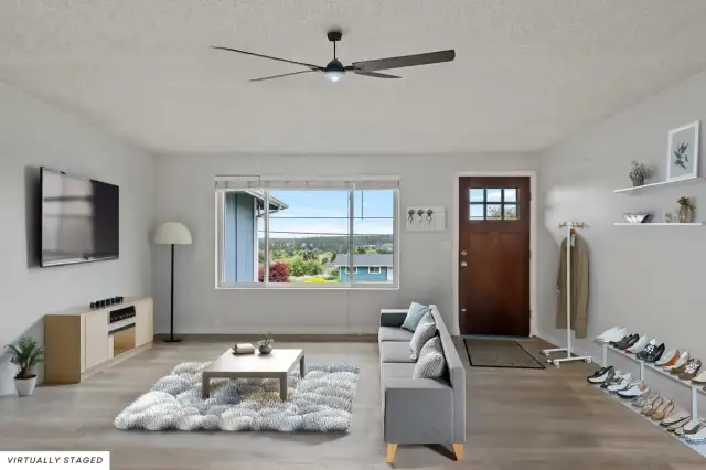 Enter into a lovely living room area with south facing windows for plenty of light, no matter the season.
