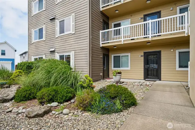 Front entry with sidewalks and streetlights.