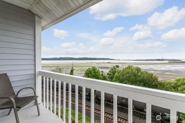 Step outside the main level covered deck, where you can relax and watch the birds drift by as you soak up the fresh sea air.
